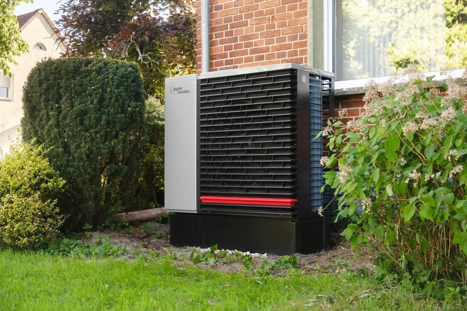 High-efficiency air conditioning condenser unit installed outside a Bronx home